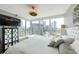 Comfortable bedroom with expansive views, hardwood floors, modern furniture, and ample natural light at 3338 Peachtree Ne Rd # 1507, Atlanta, GA 30326