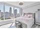 Cozy bedroom with city view, light walls, and chic furnishings, flooded with natural light at 3338 Peachtree Ne Rd # 1507, Atlanta, GA 30326