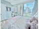 Bright bedroom featuring large windows with city views and light, modern decor at 3338 Peachtree Ne Rd # 1507, Atlanta, GA 30326