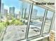 Expansive city view including parking lot from large Primary suite windows on a sunny day at 3338 Peachtree Ne Rd # 1507, Atlanta, GA 30326