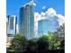 Modern buildings with green landscaping and fluffy white clouds in the background at 3338 Peachtree Ne Rd # 1507, Atlanta, GA 30326