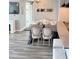 Bright dining area featuring a dark wood table with white chairs and bench seating, adjacent to a bar top at 3338 Peachtree Ne Rd # 1507, Atlanta, GA 30326