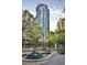Stunning view of the community with a large skyscraper, green spaces, and a fountain at 3338 Peachtree Ne Rd # 1507, Atlanta, GA 30326