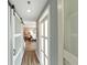 Hallway featuring a sliding barn door and contrasting white trim, leading to living areas and bedrooms at 3338 Peachtree Ne Rd # 1507, Atlanta, GA 30326