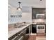 Modern kitchen features granite countertops and stainless appliances with barstool seating at 3338 Peachtree Ne Rd # 1507, Atlanta, GA 30326