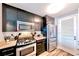 Stylish kitchen boasts stainless steel appliances, granite countertops, modern cabinetry and bright white subway tile at 3338 Peachtree Ne Rd # 1507, Atlanta, GA 30326
