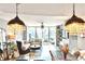 Open living space with hardwood floors, modern lighting and furniture and sliding glass doors leading to balcony with city view at 3338 Peachtree Ne Rd # 1507, Atlanta, GA 30326