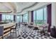 Upscale residents lounge with modern decor, cityscape views, and comfortable seating by floor-to-ceiling windows at 3338 Peachtree Ne Rd # 1507, Atlanta, GA 30326