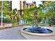 Beautiful park area with a unique fountain sculpture, lush greenery, and walkways at 3338 Peachtree Ne Rd # 1507, Atlanta, GA 30326