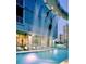 Community pool with waterfall feature against the building's exterior at 3338 Peachtree Ne Rd # 1507, Atlanta, GA 30326