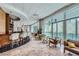 Bright resident lounge area with sleek bar, comfortable seating, and beautiful views of the swimming pool at 3338 Peachtree Ne Rd # 1507, Atlanta, GA 30326