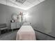 Clean spa room featuring neutral decor, modern storage, and comfortable treatment table at 3338 Peachtree Ne Rd # 1507, Atlanta, GA 30326