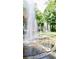 Water fountain featuring a circular stone base and multiple jets surrounded by lush greenery at 3338 Peachtree Ne Rd # 1507, Atlanta, GA 30326