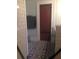 Bathroom features patterned floors, white tiled walls, a dark wood door, and a towel bar at 563 Ralph Mcgill Ne Blvd, Atlanta, GA 30312