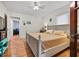 Bedroom features a queen bed, hardwood flooring, and doorway to an adjacent room at 563 Ralph Mcgill Ne Blvd, Atlanta, GA 30312