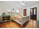 Bedroom features a queen bed, hardwood flooring, and doorway to an ensuite bathroom at 563 Ralph Mcgill Ne Blvd, Atlanta, GA 30312
