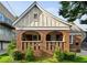 Quaint brick home featuring an inviting covered porch with classic archways at 563 Ralph Mcgill Ne Blvd, Atlanta, GA 30312