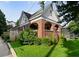 Attractive brick home featuring an arched porch and a neatly manicured lawn at 563 Ralph Mcgill Ne Blvd, Atlanta, GA 30312