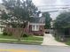 Cozy brick home with well-maintained front lawn and private driveway at 563 Ralph Mcgill Ne Blvd, Atlanta, GA 30312