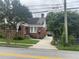 Quaint brick home with a neatly kept lawn and convenient private driveway at 563 Ralph Mcgill Ne Blvd, Atlanta, GA 30312