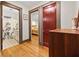 Hallway with views into the bathroom and bedroom, separated by wood-framed doorways at 563 Ralph Mcgill Ne Blvd, Atlanta, GA 30312