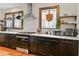 Charming kitchen features dark cabinets, stainless steel appliances, and marble countertops at 563 Ralph Mcgill Ne Blvd, Atlanta, GA 30312