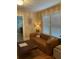Inviting living room with a modern leather sofa, neutral tones, and bright natural light at 563 Ralph Mcgill Ne Blvd, Atlanta, GA 30312