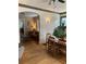 Open-concept living and dining areas with hardwood floors, ample lighting, and plants at 563 Ralph Mcgill Ne Blvd, Atlanta, GA 30312