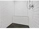 Modern shower featuring white subway tile and a stylish penny tile floor at 563 Ralph Mcgill Ne Blvd, Atlanta, GA 30312