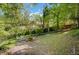Backyard entertaining space with adirondack chairs around a fire pit at 1610 Old Mill Xing, Marietta, GA 30062