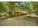 Exterior of the home with an elevated deck and patio space at 1610 Old Mill Xing, Marietta, GA 30062