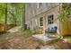 Back patio featuring a rocking chair and access to the basement at 1610 Old Mill Xing, Marietta, GA 30062