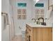 Modern bathroom features a double sink vanity with wood drawers and black fixtures at 1610 Old Mill Xing, Marietta, GA 30062