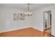 Dining room with hardwood floors, chandelier, and neutral paint at 1610 Old Mill Xing, Marietta, GA 30062