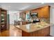 Spacious kitchen with granite countertops, stainless steel appliances, and rich wood cabinetry at 1610 Old Mill Xing, Marietta, GA 30062