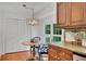 Cozy kitchen nook with pendant lighting, backyard view, and storage at 1610 Old Mill Xing, Marietta, GA 30062