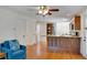 Bright and airy living room showcasing hardwood floors and open access to kitchen space at 1610 Old Mill Xing, Marietta, GA 30062