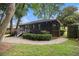 Backyard with a newly built deck, black stained fence and manicured landscaping at 1853 Pinedale Pl, Decatur, GA 30032