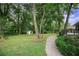 Spacious backyard with lush greenery, a storage shed, and a peaceful atmosphere at 1853 Pinedale Pl, Decatur, GA 30032