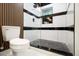 Sleek bathroom features a modern toilet and shower with black accents at 1853 Pinedale Pl, Decatur, GA 30032