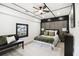 Modern bedroom featuring an accent wall, neutral paint colors, and coordinated furnishings at 1853 Pinedale Pl, Decatur, GA 30032
