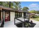 Inviting front porch with modern cable railings and freshly landscaped area, offering a welcoming entrance to the renovated home at 1853 Pinedale Pl, Decatur, GA 30032