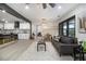 Open floor plan featuring a kitchen with a breakfast bar and modern cabinets adjacent to the living area and dining area at 1853 Pinedale Pl, Decatur, GA 30032