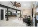 Open layout connects living, dining, and kitchen areas, with light-colored floors, beams and a modern ceiling fan at 1853 Pinedale Pl, Decatur, GA 30032