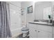 Well-lit bathroom featuring a shower-tub combination, granite countertop vanity, and ample storage at 4021 Melvin Sw Dr, Atlanta, GA 30331