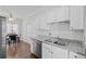 Bright kitchen with granite countertops, stainless steel appliances, and an adjacent dining area at 4021 Melvin Sw Dr, Atlanta, GA 30331