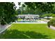 Inviting backyard with a refreshing pool, sun loungers, and a manicured lawn, perfect for relaxation and leisure at 4095 N Broadland Nw Rd, Atlanta, GA 30342
