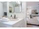 Bright bathroom features a modern sink and vanity next to bedroom view at 4095 N Broadland Nw Rd, Atlanta, GA 30342