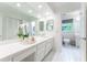 Bathroom featuring double sink vanity, and white tile flooring at 4095 N Broadland Nw Rd, Atlanta, GA 30342