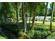 Beautiful home surrounded by mature trees and a flowing stream, offering a serene and peaceful setting at 4095 N Broadland Nw Rd, Atlanta, GA 30342